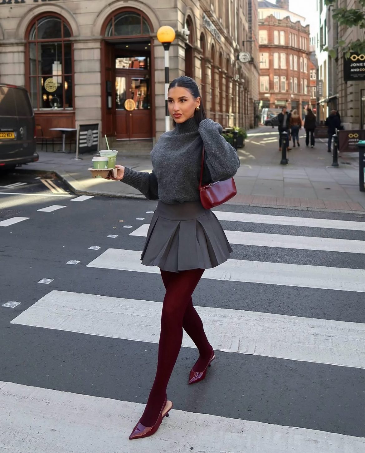 woman shopping for black friday deals outside on crosswalk